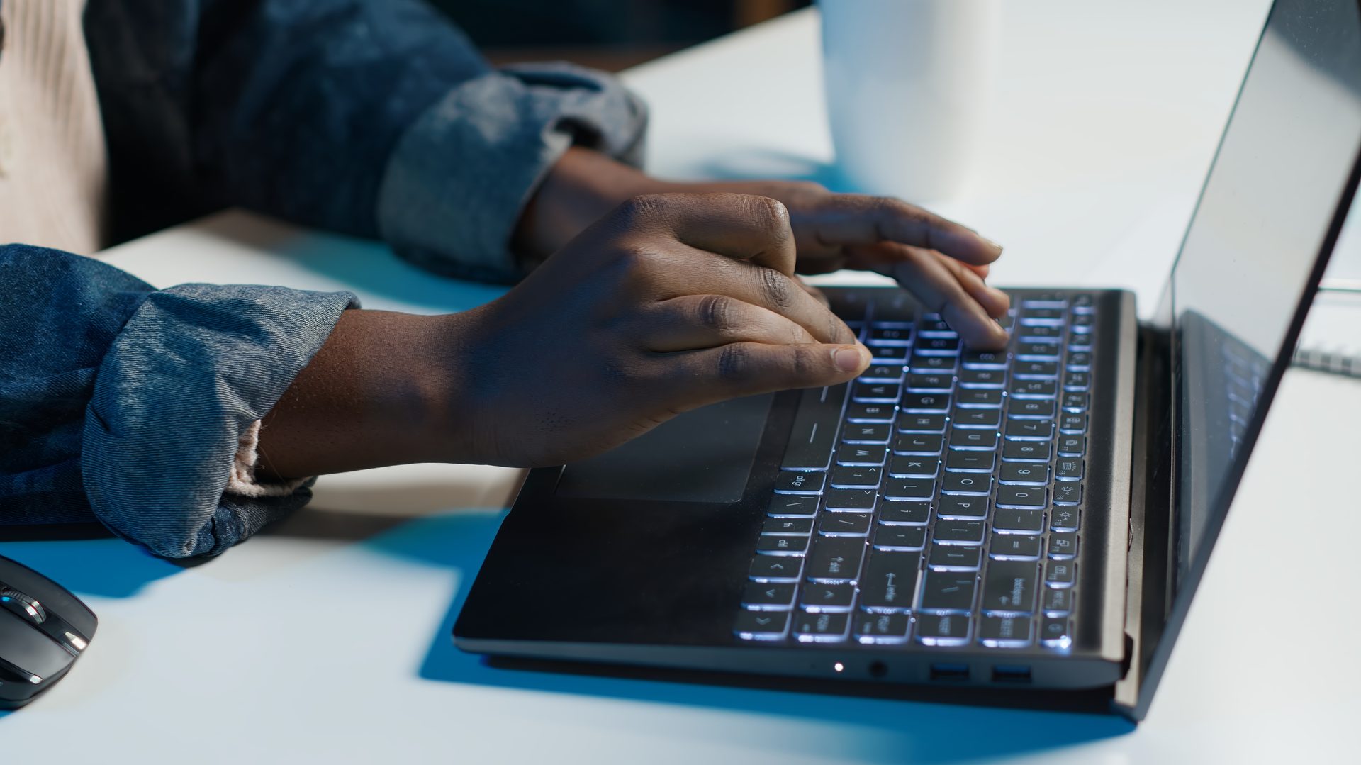 Customer support representative working at a computer