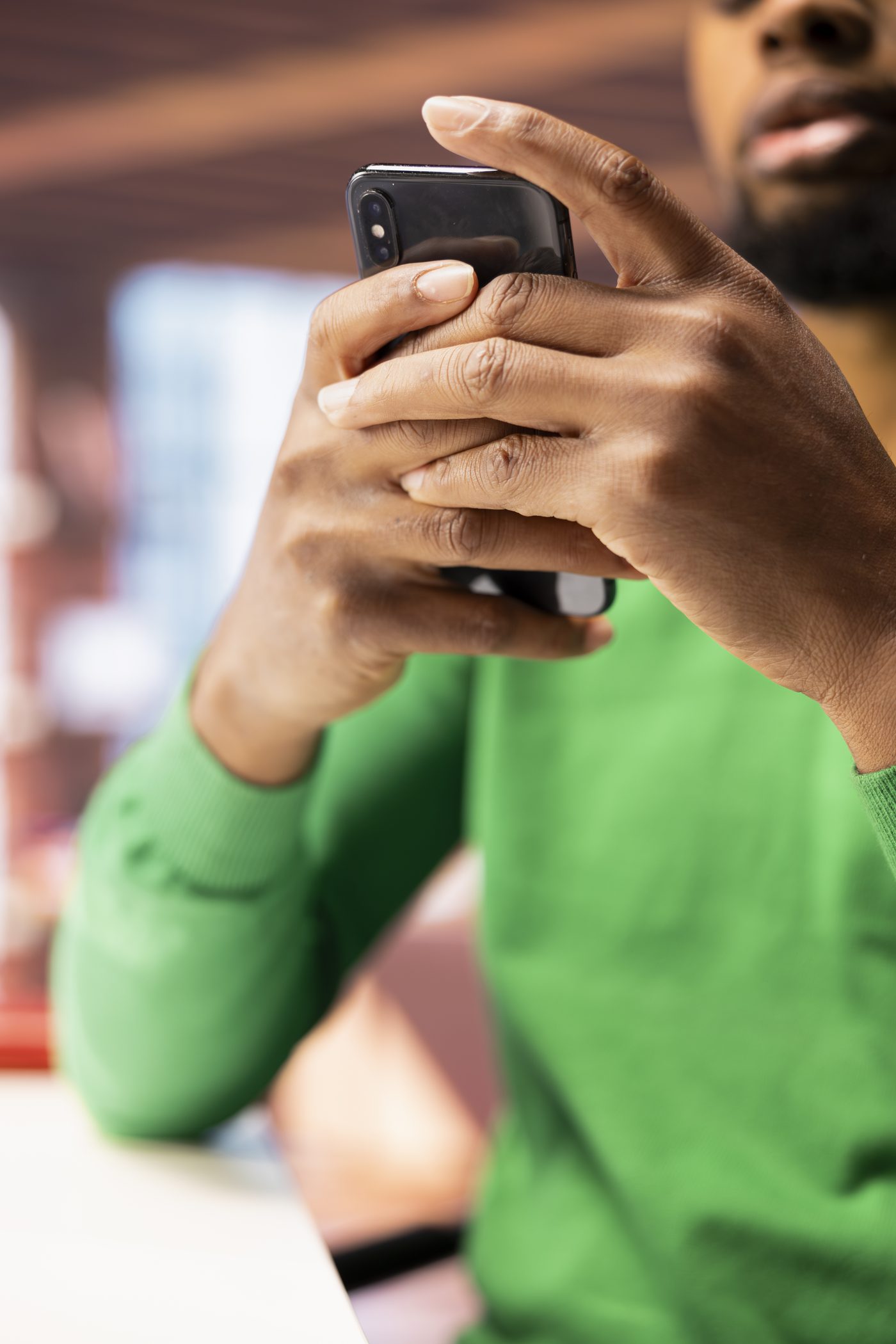 Customer using a phone while sitting at a desk